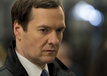 LLANTRISANT, UNITED KINGDOM - MARCH 25: Chancellor George Osborne is seen during a visit to the Royal Mint to see how it has been affected by the budget on March 25, 2014 in Llantrisant, Wales. In the Chancellor's budget statement last week he announced a new design for a 12-sided one pound coin which is designed to be much harder to fake and is based on the pre-decimal 'threepenny bit' three pence piece. (Photo by Matthew Horwood - WPA Pool/Getty Images)