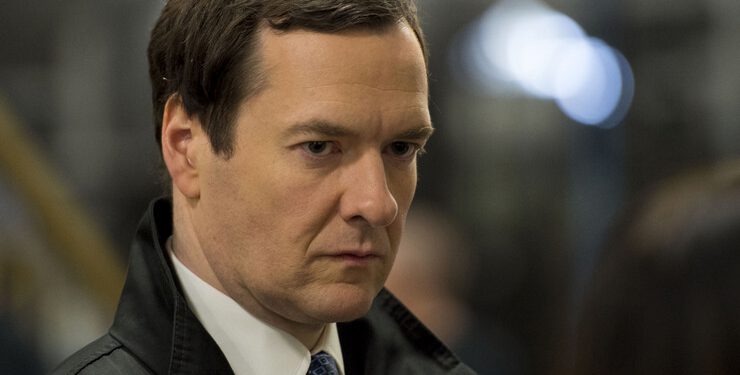 LLANTRISANT, UNITED KINGDOM - MARCH 25: Chancellor George Osborne is seen during a visit to the Royal Mint to see how it has been affected by the budget on March 25, 2014 in Llantrisant, Wales. In the Chancellor's budget statement last week he announced a new design for a 12-sided one pound coin which is designed to be much harder to fake and is based on the pre-decimal 'threepenny bit' three pence piece. (Photo by Matthew Horwood - WPA Pool/Getty Images)