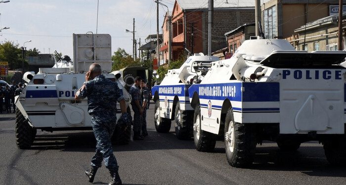 Policemen block a street after a group of armed men seized a police station along with an unknown number of hostages, according the country's security service, in Yerevan, Armenia, July 17, 2016. REUTERS/Melik Baghdasaryan/Photolure EDITORIAL USE ONLY. NO RESALES. NO ARCHIVE