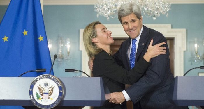 epa04574367 US Secretary of State John Kerry (R) and EU High Representative Federica Mogherini (L) embrace after holding a joint news conference, at the State Department in Washington, DC, USA, 21 January 2015. Kerry and Mogherini discussed a wide array of issues including the situation in Yemen, Cuba, the Ukraine and relations with Russia and possible sanctions against Iran.  EPA/MICHAEL REYNOLDS/2015-01-22 06:44:58/