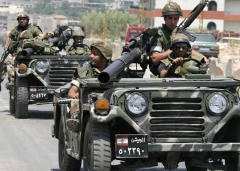 NAHR AL-BARED, LEBANON: Lebanese soldiers patrol in the outskirts of the Palestinian refugee camp of Nahr al-Bared in northern Lebanon, 04 June 2007. The eruption of deadly violence at a second Palestinian refugee camp in Lebanon has raising fears of violence spreading through the country's dozen camps that have become breeding grounds for extremism. AFP PHOTO / RAMZI HAIDAR (Photo credit should read RAMZI HAIDAR/AFP/Getty Images)