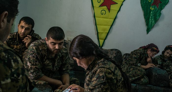 To follow a story on YPG fighters striking ISIS position by Rukmini Callimachi - Hasaka, Syria - July 31, 2015: YPG fighters check maps and location as they coordinate one air strike on ISIS position inside Hasaka, at a YPG headquarters on the outskirts of Hasaka. CREDIT: Photo by Mauricio Lima for The New York Times                              NYTCREDIT: Mauricio Lima for The New York Times