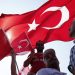 epa05461183 People wave Turkish flags during a rally to protest the failed coup attempt at 15th July 2016 and mourn the 240 killed people including civilians, policemen, and soldiers, 07 August 2016, Istanbul. Thousands of people attend a massive  democracy rally in Istanbul to protest the 15 th coup attempt.  The president, prime minister, main opposition head and the leader of the countryÕs foremost nationalist party join the rally.  EPA/SEDAT SUNA