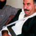 FILE - In this  Monday Feb. 15, 1999 file photo  provided by the Turkish Intelligence Service o the chief of the Kurdistan Workers Party, PKK, Abdullah Ocalan sits guarded aboard an aircraft en route to Turkey following his arrest by Turkish special forces in Nairobi, Kenya. Imprisoned Kurdish rebel leader Abdullah Ocalan said Monday, March 18, 2013 that peace talks with Turkey are making "positive progress" and that he plans to make a "historic" announcement to coincide with a Kurdish spring festival. (AP Photo/Turkish Intelligence Service, File)