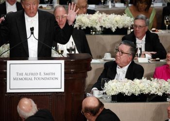 Democratic presidential candidate Hillary Clinton, right, reacts as Republican presidential candidate Donald Trump speaks during the Alfred E. Smith Memorial Foundation dinner, Thursday, Oct. 20, 2016, in New York. (AP Photo/ Evan Vucci)
