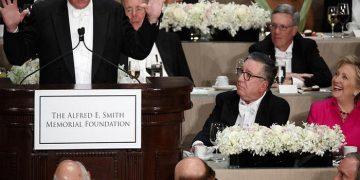 Democratic presidential candidate Hillary Clinton, right, reacts as Republican presidential candidate Donald Trump speaks during the Alfred E. Smith Memorial Foundation dinner, Thursday, Oct. 20, 2016, in New York. (AP Photo/ Evan Vucci)