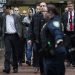 Martin Shkreli, chief executive officer of Turing Pharmaceuticals LLC, center, and attorney Evan Greebel, left, exit federal court in New York, U.S., on Thursday, Dec. 17, 2015. Shkreli was arrested on alleged securities fraud related to Retrophin Inc., a biotech firm he founded in 2011. Greebel is accused of conspiring with Shkreli in part of the scheme. Photographer: John Taggart/Bloomberg *** Local Caption *** Martin Shkreli; Evan Greebel