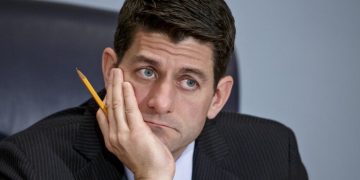 House Ways and Means Committee Chairman Paul Ryan, R-Wisc., listens as Treasury Secretary Jack Lew defends President Barack Obama's new budget proposals, on Capitol Hill in Washington, Tuesday, Feb. 3, 2015. Rep. Ryan,  who agrees with Obama on extending the earned income tax credit to more workers without children, says he hopes that lawmakers and the administration could agree on ways to finance expanding the EITC. (AP Photo/J. Scott Applewhite)