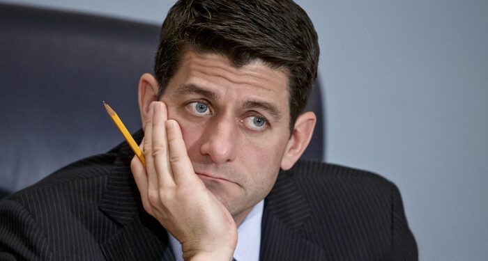 House Ways and Means Committee Chairman Paul Ryan, R-Wisc., listens as Treasury Secretary Jack Lew defends President Barack Obama's new budget proposals, on Capitol Hill in Washington, Tuesday, Feb. 3, 2015. Rep. Ryan,  who agrees with Obama on extending the earned income tax credit to more workers without children, says he hopes that lawmakers and the administration could agree on ways to finance expanding the EITC. (AP Photo/J. Scott Applewhite)