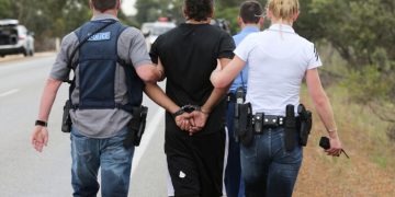 ###LEGAL LEGAL LEGAL### PICTURE BY NIC ELLIS  1 OCTOBER 2014
THE WEST AUSTRALIAN  FAIRFAX AND AUSTRALIAN
FINANCIAL REVIEW OUT
A man under arrest on the Brand Highway north of Muchea, after a police pursuit, when he abandoned the stolen vehicle he was driving.