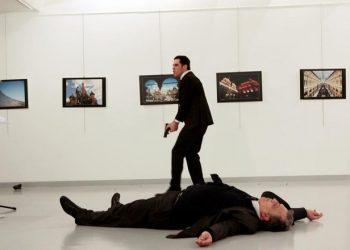 Russian Ambassador to Turkey Andrei Karlov lies on the ground after he was shot by unidentified man at an art gallery in Ankara, Turkey, December 19, 2016. Hasim Kilic/Hurriyet via REUTERS