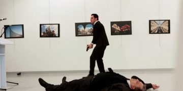 Russian Ambassador to Turkey Andrei Karlov lies on the ground after he was shot by unidentified man at an art gallery in Ankara, Turkey, December 19, 2016. Hasim Kilic/Hurriyet via REUTERS