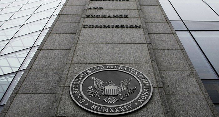 FILE- In this file photo made Dec. 17, 2008, shows the exterior of the Securities and Exchange Commission (SEC) headquarters in Washington. Federal regulators filed civil fraud charges against an investment adviser and his firm in connection with complex securities tied to mortgages during the housing market bust. (AP Photo/File)