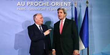 French Minister of Foreign Affairs Jean-Marc Ayrault welcomes US Secretary of State John Kerry as he arrives for the Mideast peace conference in Paris, France, January 15, 2017. REUTERS/Bertrand Guay/POOL