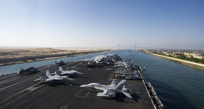 160708-N-QN175-009 SUEZ CANAL (July 8, 2016) - The aircraft carrier USS Dwight D. Eisenhower (CVN 69) approaches the Friendship Bridge as it transits the Suez Canal. The Eisenhower Carrier Strike Group is deployed in support of maritime security operations and theater security cooperation efforts in the U.S. 5th Fleet area of operations. (U.S. Navy photo by Mass Communication Specialist Seaman Dartez C. Williams/Released)