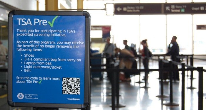 This undated image released by the Transportation Security Administration shows a sign promoting the TSA PreCheck program at at Reagan National Airport in Washington. The Transportation Security Administration's PreCheck program is open to some elite frequent fliers as well as travelers enrolled in one of the Customs & Border Protection's expedited entry programs: Global Entry, Nexus and Sentri. These travelers are considered less of a terrorist risk and therefore don't have to go through as stringent of a screening process.  (AP Photo/TSA)