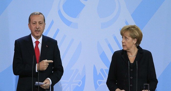 German Chancellor Angela Merkel (R) and Turkish Prime Minister Tayyip Erdogan address the media after talks in Berlin October 31, 2012. REUTERS/Tobias Schwarz (GERMANY - Tags: POLITICS) - RTR39T8F