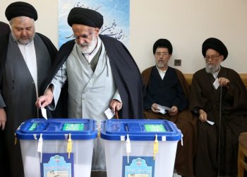 Iranian clergymen vote in the parliamentary and Experts Assembly elections at a polling station in Qom, 125 kilometers (78 miles) south of the capital Tehran, Iran, Friday, Feb. 26, 2016. Iranians across the Islamic Republic voted Friday in the country's first election since its landmark nuclear deal with world powers, deciding whether to further empower its moderate president or side with hard-liners long suspicious of the West. The election for Iran's parliament and a clerical body known as the Assembly of Experts hinges on both the policies of President Hassan Rouhani, as well as Iranians worries about the country's economy, long battered by international sanctions. (AP Photo/Ebrahim Noroozi)