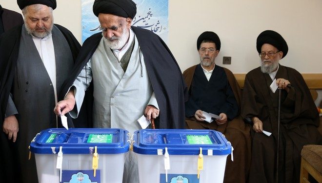 Iranian clergymen vote in the parliamentary and Experts Assembly elections at a polling station in Qom, 125 kilometers (78 miles) south of the capital Tehran, Iran, Friday, Feb. 26, 2016. Iranians across the Islamic Republic voted Friday in the country's first election since its landmark nuclear deal with world powers, deciding whether to further empower its moderate president or side with hard-liners long suspicious of the West. The election for Iran's parliament and a clerical body known as the Assembly of Experts hinges on both the policies of President Hassan Rouhani, as well as Iranians worries about the country's economy, long battered by international sanctions. (AP Photo/Ebrahim Noroozi)