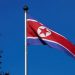 FILE PHOTO - A North Korean flag flies on a mast at the Permanent Mission of North Korea in Geneva October 2, 2014. REUTERS/Denis Balibouse/File Photo