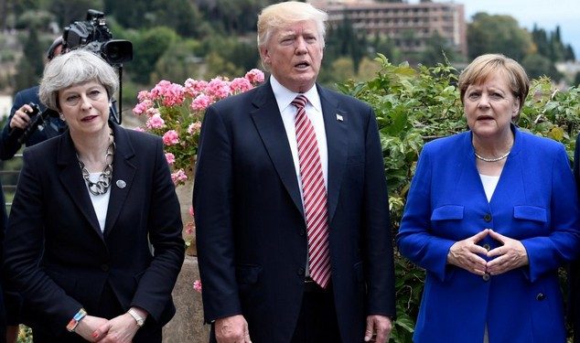 (L-R) Britain's Prime Minister Theresa May, US President Donald Trump and German Chancellor Angela Merkel arrive to watch an Italian flying squadron during the Summit of the Heads of State and of Government of the G7, the group of most industrialized economies, plus the European Union, on May 26, 2017 in Taormina, Sicily. The leaders of Britain, Canada, France, Germany, Japan, the US and Italy will be joined by representatives of the European Union and the International Monetary Fund (IMF) as well as teams from Ethiopia, Kenya, Niger, Nigeria and Tunisia during the summit from May 26 to 27, 2017. / AFP PHOTO / POOL / STEPHANE DE SAKUTINSTEPHANE DE SAKUTIN/AFP/Getty Images