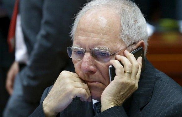 German Finance Minister Wolfgang Schaeuble speaks on his mobile phone as he takes part in a European Union finance ministers meeting in Brussels, Belgium, February 12, 2016.  REUTERS/Yves Herman