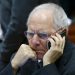 German Finance Minister Wolfgang Schaeuble speaks on his mobile phone as he takes part in a European Union finance ministers meeting in Brussels, Belgium, February 12, 2016.  REUTERS/Yves Herman