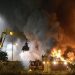 Firefighters work to extinguish flames after a massive blaze torched a recycling station in Malmo, Southern Sweden June 27, 2013. The fire broke out on Thursday evening around 7 pm local time in the area of Norra Hamnen. No casualties were reported. Picture taken June 27, 2013. REUTERS/Johan Nilsson/Scanpix Sweden (SWEDEN - Tags: DISASTER TPX IMAGES OF THE DAY) ATTENTION EDITORS - THIS IMAGE WAS PROVIDED BY A THIRD PARTY. FOR EDITORIAL USE ONLY. NOT FOR SALE FOR MARKETING OR ADVERTISING CAMPAIGNS. THIS PICTURE IS DISTRIBUTED EXACTLY AS RECEIVED BY REUTERS, AS A SERVICE TO CLIENTS.  NO COMMERCIAL SALES. SWEDEN OUT. NO COMMERCIAL OR EDITORIAL SALES IN SWEDEN - RTX114IN