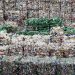 LONDON - MARCH 25:  An employee of the 'Closed Loop Recycling' plant walks past stacks of plastic bottles at their plant in Dagenham on March 25, 2010 in London, United Kingdom. The state of the art plant is the first in the UK to produce food grade recycled plastic from bottle waste. Over 35,00 tonnes of plastic bottles are recycled at the plant annually, representing almost 20% of the plastic bottles currently collected for recycling in the UK, and saving approximately 52,500 tonnes of carbon dioxide per year.  (Photo by Dan Kitwood/Getty Images)