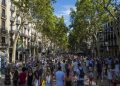 Barcelona, Spain- July 25: Famous street La Rambla in Barcelona, Spain. Thousands of people walk daily by this popular pedestrian area 1.2 kilometer long.