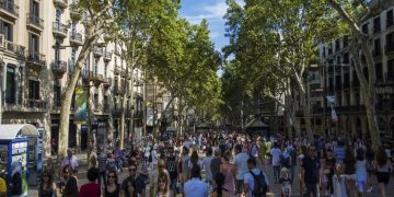 Barcelona, Spain- July 25: Famous street La Rambla in Barcelona, Spain. Thousands of people walk daily by this popular pedestrian area 1.2 kilometer long.