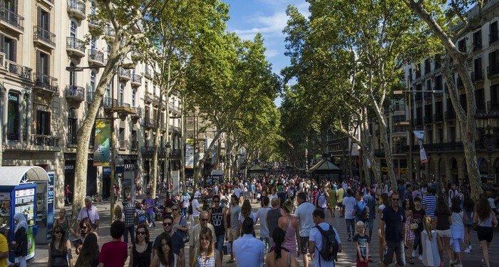 Barcelona, Spain- July 25: Famous street La Rambla in Barcelona, Spain. Thousands of people walk daily by this popular pedestrian area 1.2 kilometer long.