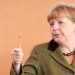 BERLIN, GERMANY - MARCH 13:  German Chancellor Angela Merkel arrives for the weekly German federal Cabinet meeting on March 13, 2013 in Berlin, Germany. High on the morning's agenda was discussion about the 2014 federal budget as well as options for helping women during pregnancy.  (Photo by Adam Berry/Getty Images)