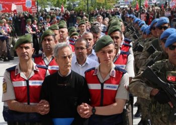 Turkish Gendarmerie escort defendants Akin Ozturk (2L) and others involved in last Julys attempted coup in Turkey as they leave the prison where they are being held, ahead of their trial in Ankara, on May 22, 2017.
The trial opened on May 22, 2017 of more than 220 suspects, including over two dozen former Turkish generals, accused of being among the ringleaders of the attempted coup last year aimed at ousting President Recep Tayyip Erdogan. / AFP PHOTO / ADEM ALTAN        (Photo credit should read ADEM ALTAN/AFP/Getty Images)