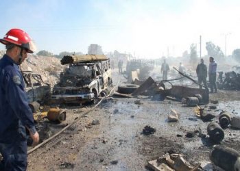 epa03916892 A handout picture made available by the Syrian Arab News Agency (SANA) shows Syrian firemen working at the site of car bombing in the central province of Hama, Syria, 20 October 2013. At least 31 people, including government soldiers, were killed in the bombing that was targeting a security checkpoint in the province of Hama. The bombing came as Arab League head Nabil al-Arabi said 23 November had been set as the date for a new international conference aimed at ending Syria's 31-month conflict.  EPA/SANA HANDOUT  HANDOUT EDITORIAL USE ONLY/NO SALES