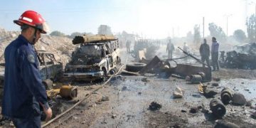 epa03916892 A handout picture made available by the Syrian Arab News Agency (SANA) shows Syrian firemen working at the site of car bombing in the central province of Hama, Syria, 20 October 2013. At least 31 people, including government soldiers, were killed in the bombing that was targeting a security checkpoint in the province of Hama. The bombing came as Arab League head Nabil al-Arabi said 23 November had been set as the date for a new international conference aimed at ending Syria's 31-month conflict.  EPA/SANA HANDOUT  HANDOUT EDITORIAL USE ONLY/NO SALES