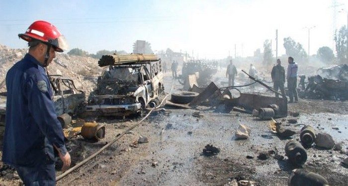 epa03916892 A handout picture made available by the Syrian Arab News Agency (SANA) shows Syrian firemen working at the site of car bombing in the central province of Hama, Syria, 20 October 2013. At least 31 people, including government soldiers, were killed in the bombing that was targeting a security checkpoint in the province of Hama. The bombing came as Arab League head Nabil al-Arabi said 23 November had been set as the date for a new international conference aimed at ending Syria's 31-month conflict.  EPA/SANA HANDOUT  HANDOUT EDITORIAL USE ONLY/NO SALES