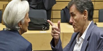 Greek Finance Minister Euclid Tsakalotos, right, speaks with Managing Director of the International Monetary Fund Christine Lagarde during a round table meeting of eurogroup finance ministers at the EU Lex building in Brussels on Sunday, July 12, 2015. Greece has another chance Sunday to convince skeptical European creditors that it can be trusted to enact wide-ranging economic reforms which would safeguard its future in the common euro currency. (AP Photo/Michel Euler)