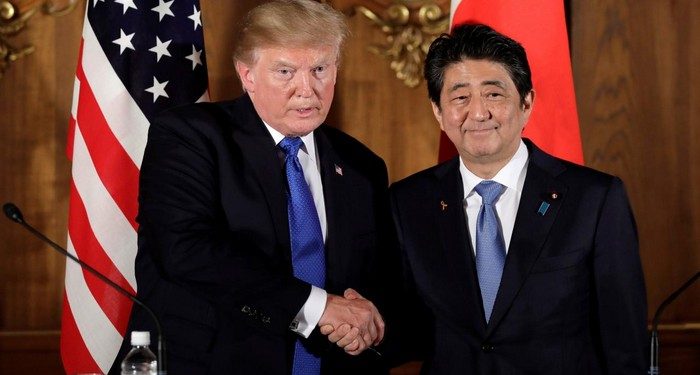 U.S. President Donald Trump, left, shakes hands with Shinzo Abe, Japan's prime minister, during a news conference at Akasaka Palace in Tokyo, Japan, November 6, 2017.   REUTERS/Kiyoshi Ota/Pool