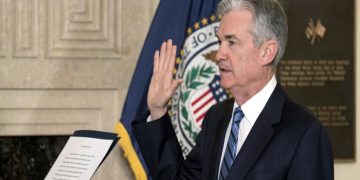 Jerome Powell takes the oath of office as Federal Reserve Board chairman at the Federal Reserve, Va., Monday, Feb. 5, 2018, in Washington. (AP Photo/Andrew Harnik)