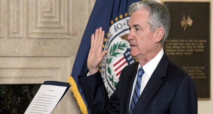 Jerome Powell takes the oath of office as Federal Reserve Board chairman at the Federal Reserve, Va., Monday, Feb. 5, 2018, in Washington. (AP Photo/Andrew Harnik)