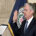 Jerome Powell takes the oath of office as Federal Reserve Board chairman at the Federal Reserve, Va., Monday, Feb. 5, 2018, in Washington. (AP Photo/Andrew Harnik)