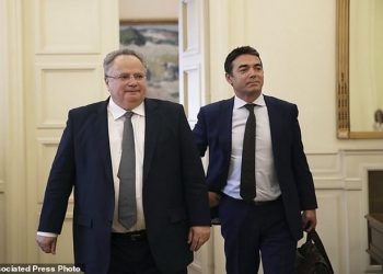 Macedonian Foreign Minister Nikola Dimitrov, right, walks next to Greek Foreign Minister Nikos Kotzias during their meeting in Athens, Wednesday, June 14, 2017. Dimitrov is in Greece on a one day official visit. (AP Photo/Petros Giannakouris)