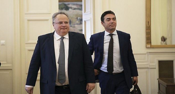 Macedonian Foreign Minister Nikola Dimitrov, right, walks next to Greek Foreign Minister Nikos Kotzias during their meeting in Athens, Wednesday, June 14, 2017. Dimitrov is in Greece on a one day official visit. (AP Photo/Petros Giannakouris)