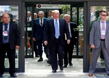 U.S. President Donald Trump is followed by National Security Advisor John Bolton (R) as he departs from the G7 summit in the Charlevoix city of La Malbaie, Quebec, Canada, June 9, 2018. REUTERS/Yves Herman