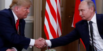 U.S. President Donald Trump and Russia's President Vladimir Putin shake hands as they meet in Helsinki, Finland July 16, 2018. REUTERS/Kevin Lamarque