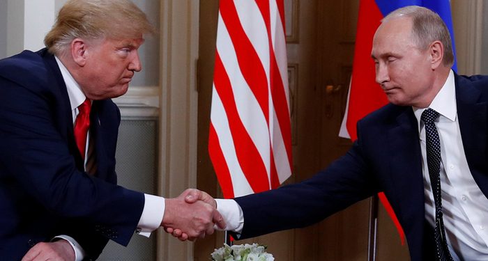 U.S. President Donald Trump and Russia's President Vladimir Putin shake hands as they meet in Helsinki, Finland July 16, 2018. REUTERS/Kevin Lamarque