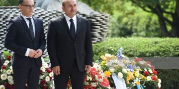 Turkish Foreign Minister Mevlut Cavusoglu (R) and German Foreign Minister Heiko Maas take part on May 29, 2018 in a ceremony at a memorial in Solingen to mark the 25th anniversary of an arson attack that killed five people of Turkish origin. - Germany remembered the five ethnic Turkish victims of a murderous neo-Nazi arson attack 25 years ago, amid warnings of resurgent German xenophobia and simmering bilateral tensions ahead of Turkish elections. (Photo by PATRIK STOLLARZ / AFP)        (Photo credit should read PATRIK STOLLARZ/AFP/Getty Images)