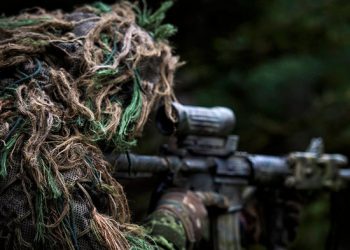 A member of the sniper team watches for the enemy during Exercise ALLIED SPIRIT V as part of Operation REASSURANCE on October 6, 2016. (Cpl Jay Ekin/DND-MDN Canada)