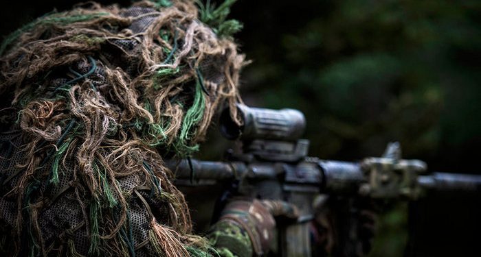 A member of the sniper team watches for the enemy during Exercise ALLIED SPIRIT V as part of Operation REASSURANCE on October 6, 2016. (Cpl Jay Ekin/DND-MDN Canada)